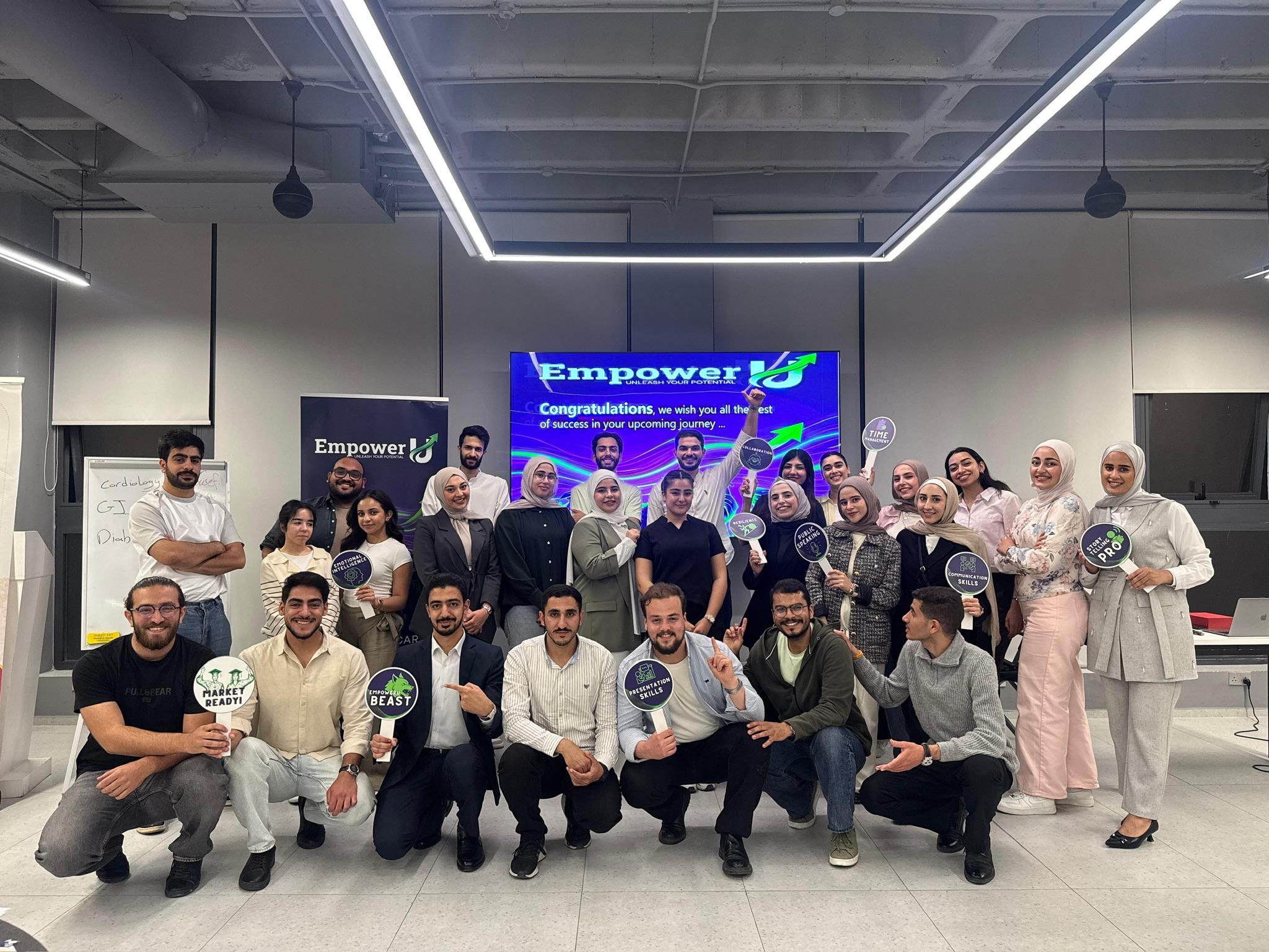 The Wave One community celebrating together with EmpowerU skills signs