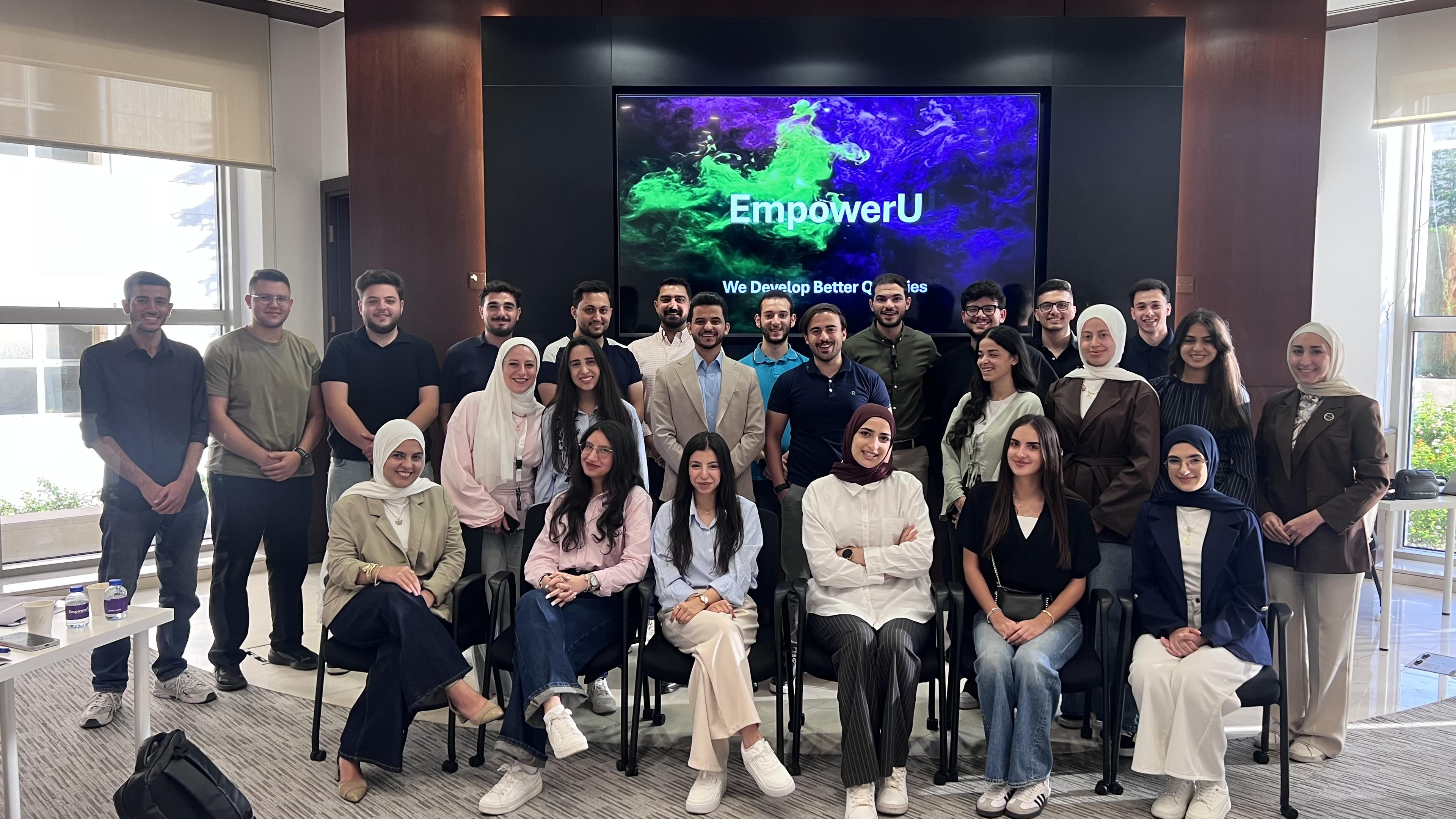 The Camp 1 cohort gathered in front of the EmpowerU screen